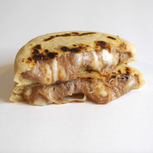 Beans & Cheese Pupusa cut in half
