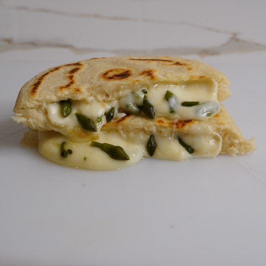 Loroco & Cheese Pupusas cut in half